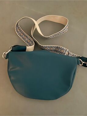 Stylish Teal Crossbody Bag with Patterned Strap